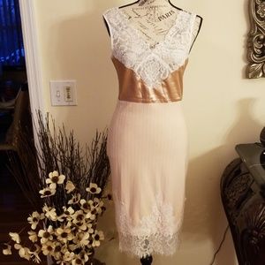 Sleeveless v-neck dress with lace detail.